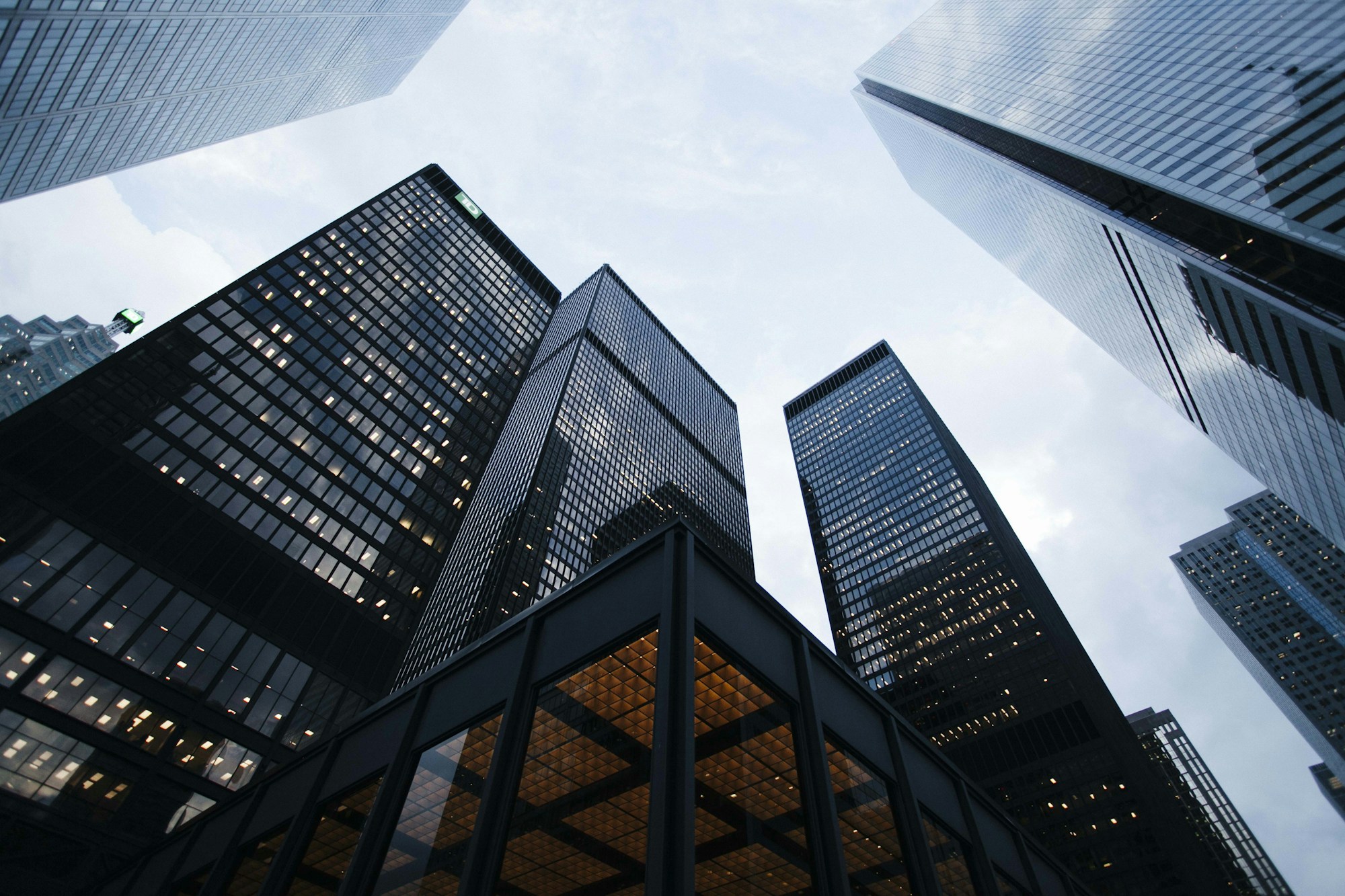 Architectural view looking up through modern commercial buildings